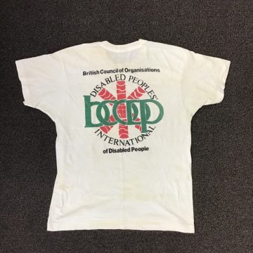 Photo of a t-shirt with the words Disabled Peoples' International, British Council of Organisations of Disabled People, BCODP