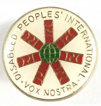 Photo of a badge with the words Disabled People's International