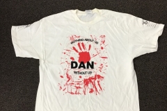Photo of a t-shirt with the slogan Nothing About Us Without Us, from the Disabled Peoples Direct Action Network