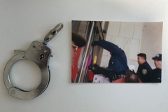 Photo of a protestor handcuffed to a door in an ADAPT protest in the USA - 1998
