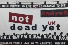 Photo of a banner with the words Not Dead Yet UK