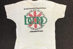 Photo of a t-shirt with the words Disabled Peoples' International, British Council of Organisations of Disabled People, BCODP