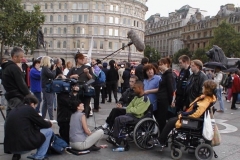 Photo: Young disabled people from GMCDP being interviewed by the media at the march and rally for BSL, Trafalgar Square London, 8 July 2000