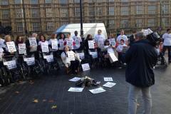Photo of disabled protestors outside Parliament for Not Dead Yet Protest November 2014.