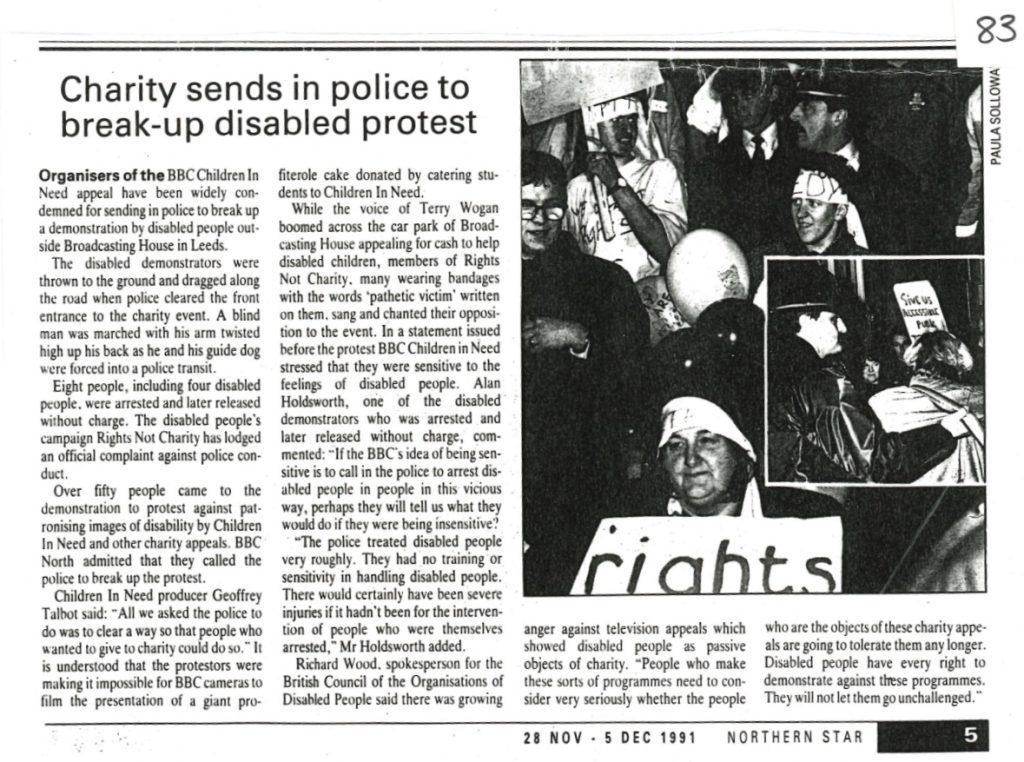Newspaper clipping with headline \"Charity sends in police to break-up disabled protest\"
